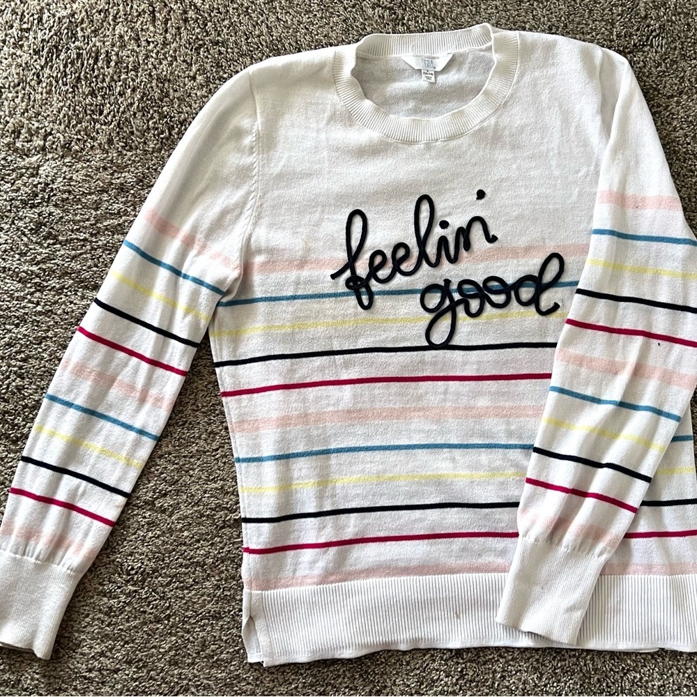 Adorable colorful time and true “feeling Good” sweater. Women’s sized 12-14